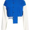 cropped blue varsity jacket with white sleeves and collar