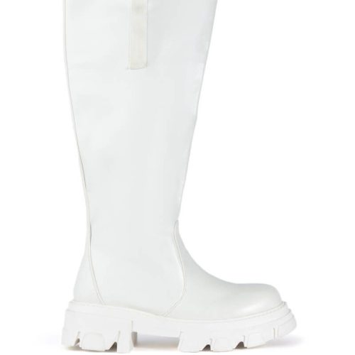 white faux leather chunky knee high boots with a flared style and chunky sole